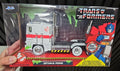 Jada: Transformers/Ghostbusters - Slimed Optimus Prime (W/ ECTO1 License Plate)
